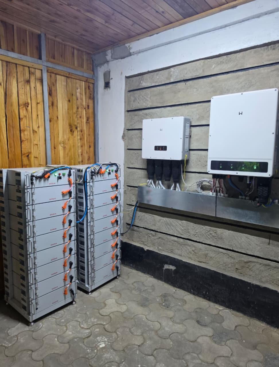 Dual hybrid inverters with stainless trunking and twin 8-module lithium battery racks